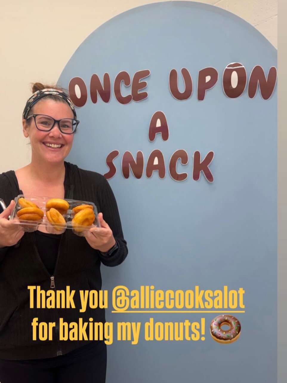 Allie Sofos holding freshly baked doughnuts
